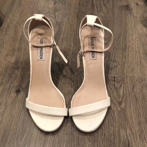 White Steve Madden heels.